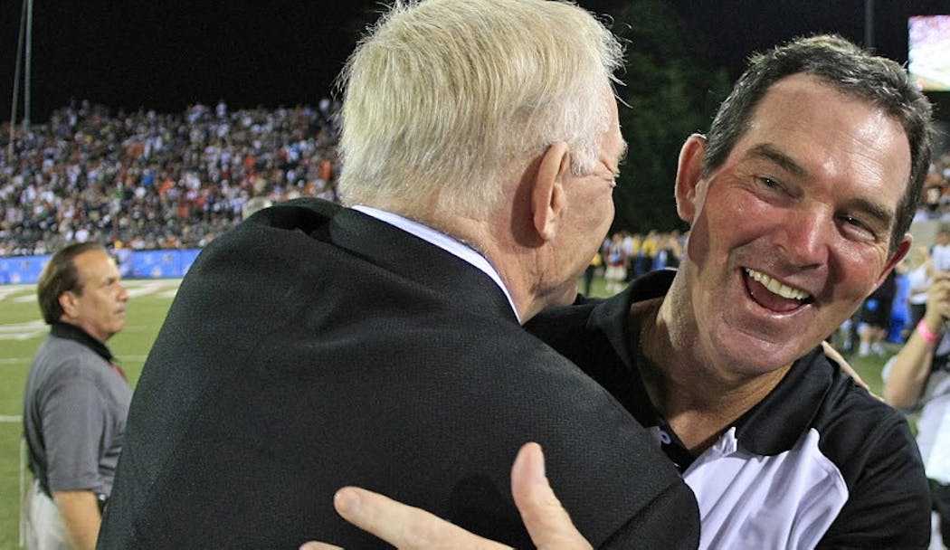Mike Zimmer, then with Cincinnati, greeted Cowboys owner Jerry Jones at the Pro Football Hall of Fame game in 2010.