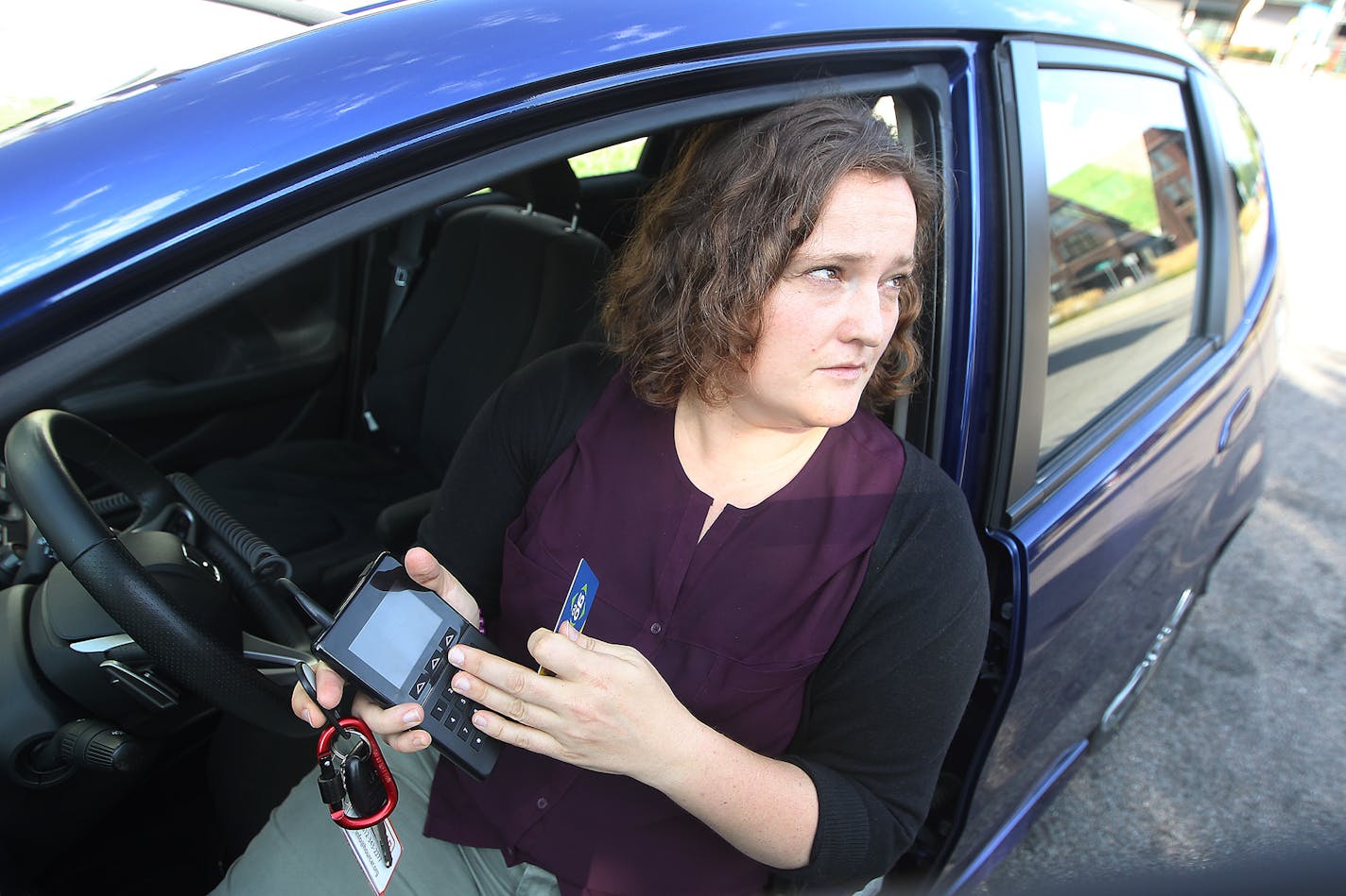 Megan Hansen Hourcar demonstrated how the new system that allows Go To card holders to check out vehicles that will be available later today, Friday, September 4, 2015 in St. Paul, MN. Metro Transit is making a deal with HourCar to allow commuters to use their Go-To cards for both transit and car sharing. ] (ELIZABETH FLORES/STAR TRIBUNE) ELIZABETH FLORES &#x2022; eflores@startribune.com