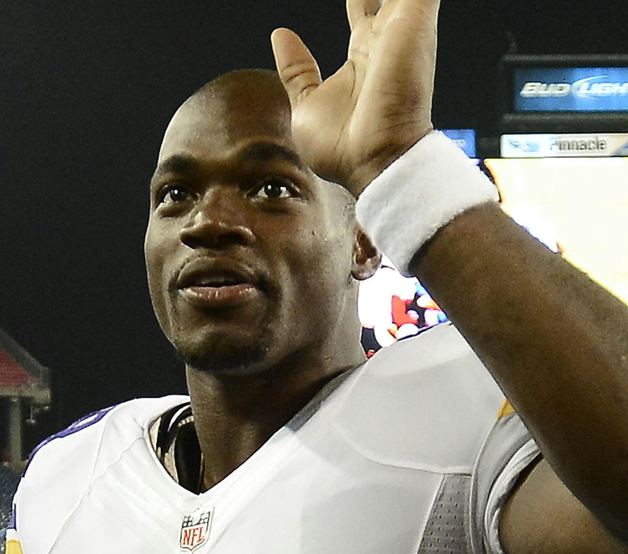 Minnesota Vikings running back Adrian Peterson (28) waves to fans as he leaves the field after a preseason NFL football game against the Tennessee Titans Thursday, Aug. 28, 2014, in Nashville, Tenn. The Vikings won 19-3. (AP Photo/Mark Zaleski)