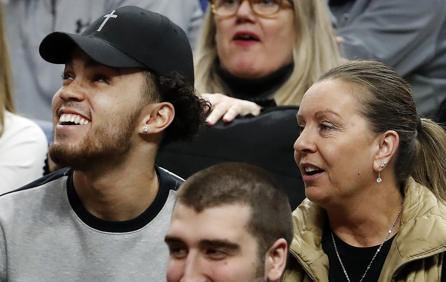 Tyus Jones and his mother, Debbie, watched Tre Jones play for Apple Valley on Wednesday at Target Center.