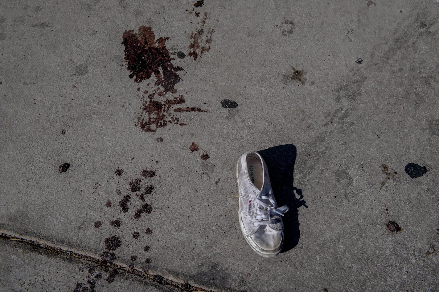 FILE — Blood and a lost shoe after the shooting at the Mandalay Bay Resort in Las Vegas, Oct. 2, 2017. "Would these images shock the country out of its morbid malaise and into action to address an unconscionable — and fully preventable — public health crisis that guns have created?" writes New York Times columnist Charles M. Blow. (Hilary Swift/The New York Times)