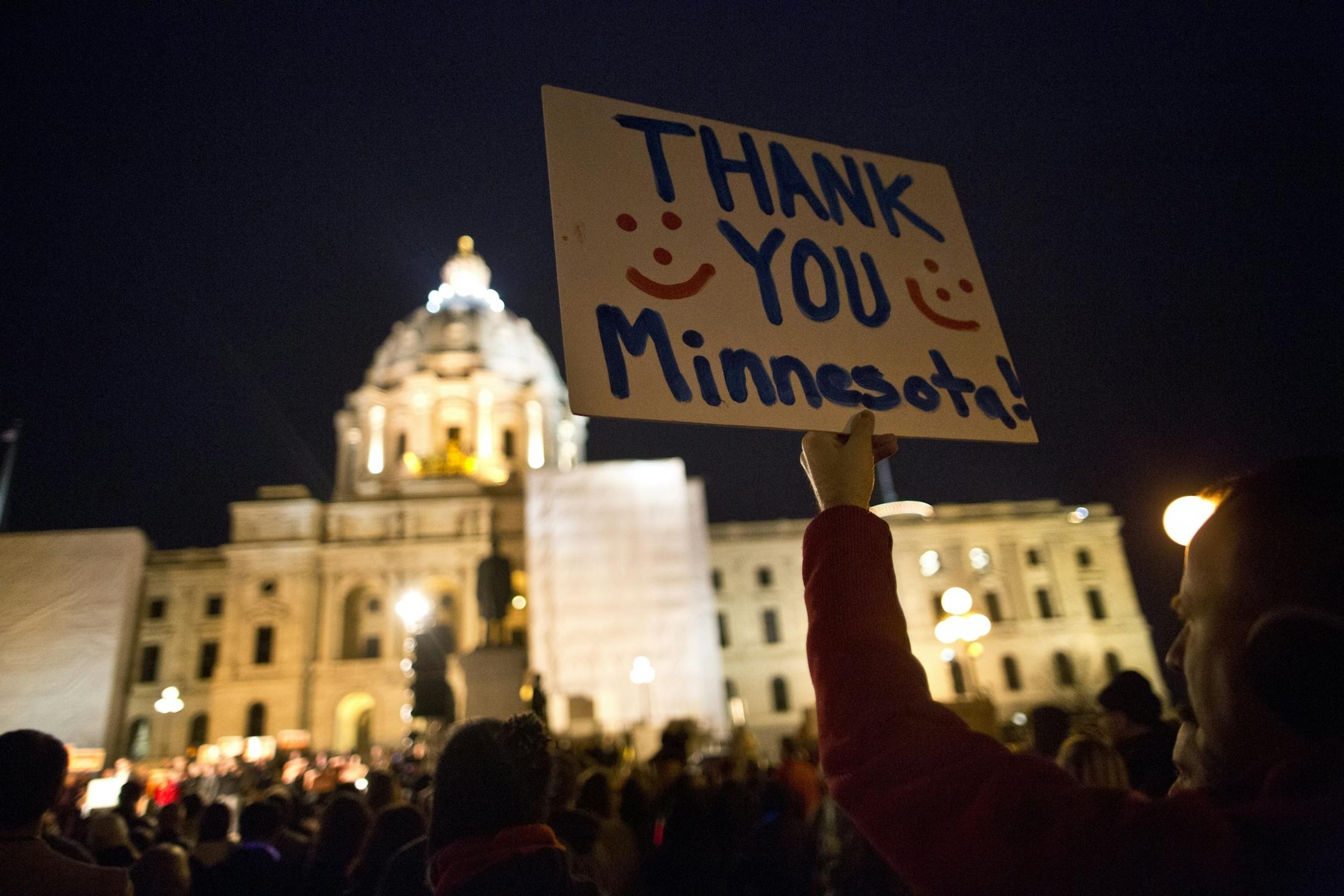Brad Weber of Eden Prairie held up a sign thanking people for voting no as opponents of an unsuccessful ballot effort to define marriage as between a man and a woman rallied outside the State Capitol in St. Paul, Minn. on Wednesday, November 7, 2012.