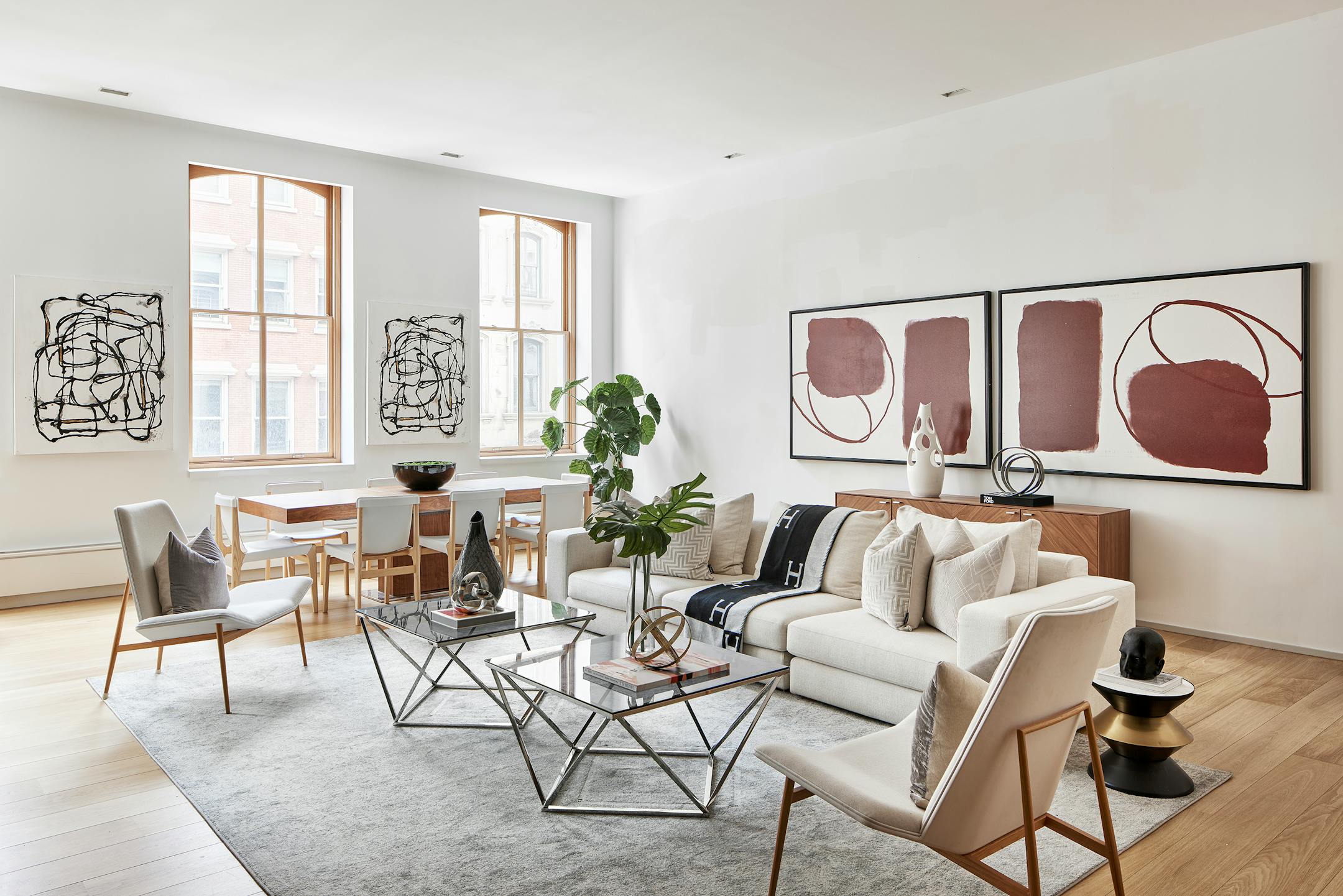 Pairings of large abstract art help to anchor this living and dining space. (Handout/TNS)