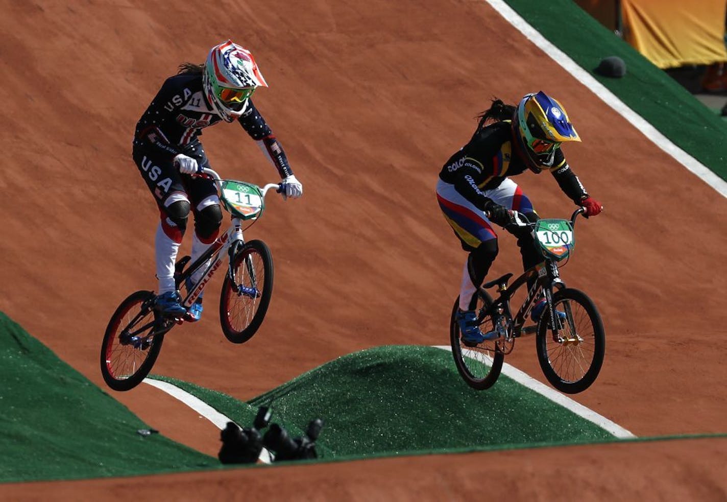 Mariana Pajon of Colombia, right, and Alise Post of the United States, left, compete in the women's BMX cycling semifinals during the 2016 Summer Olympics in Rio de Janeiro, Brazil, Friday, Aug. 19, 2016.