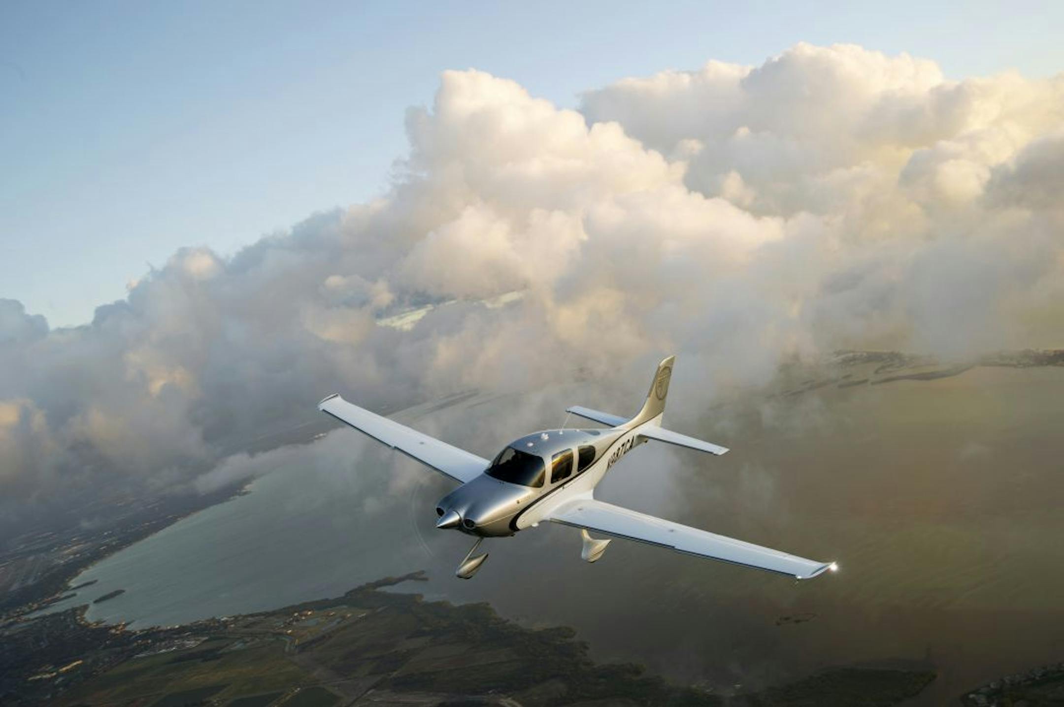 in-flight photo of a Cirrus SR22T ( propeller) plane -2013