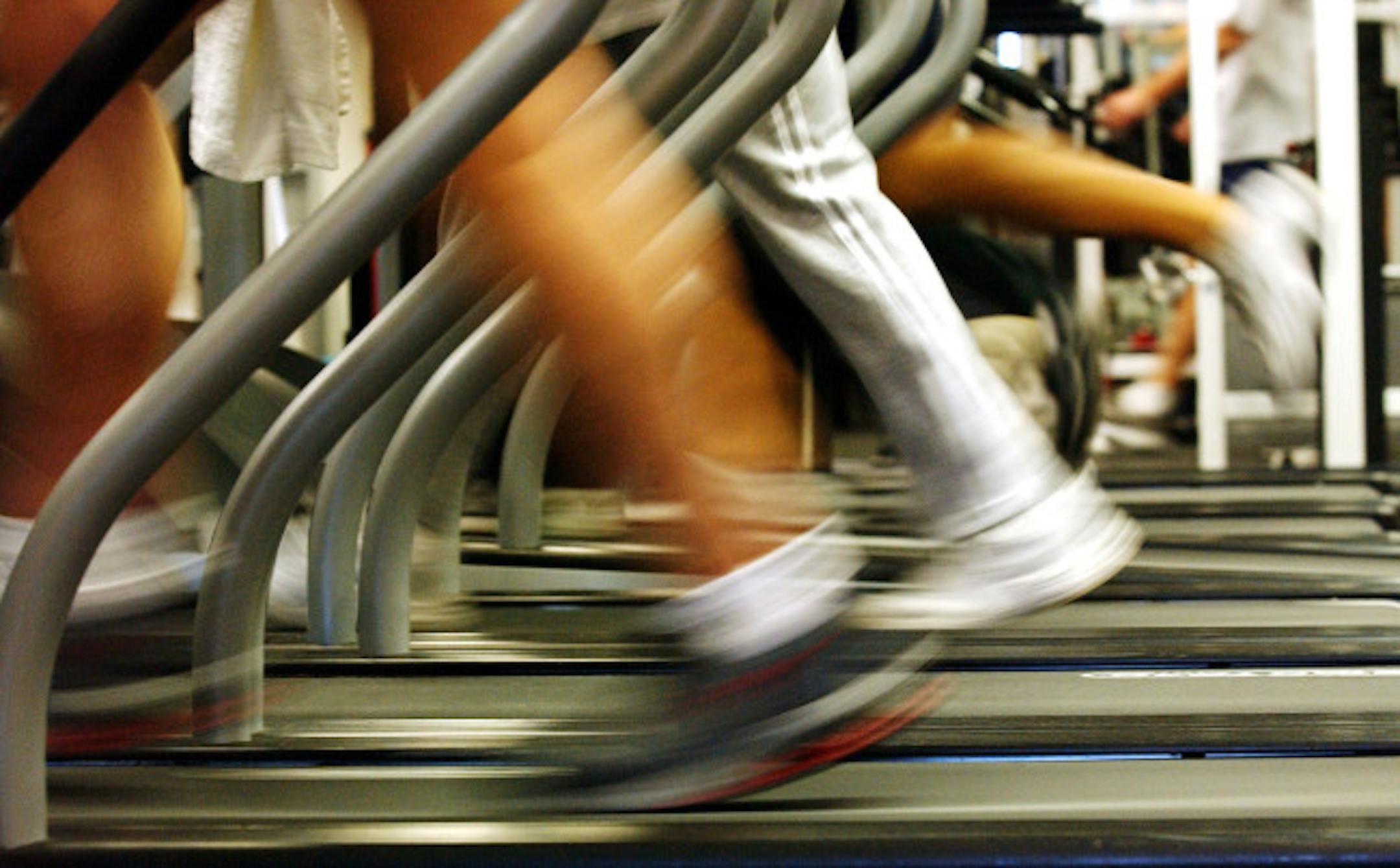 BROOKLYN, NEW YORK - JANUARY 2: People run on treadmills at a New York Sports Club January 2, 2003 in Brooklyn, New York. Thousands of people around the country join health clubs in the first week of the new year as part of their New Year's resolution. Many health clubs see a surge in business of 25 percent immediately after the new year, only to see those numbers level off by spring.