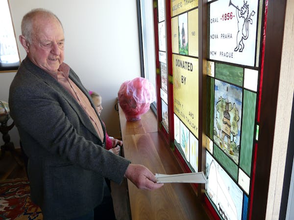 In this December 2008 file photo, Joe Tikalsky shows family members, including granddaughter Olivia, 9, some of the features of the stained glass wind