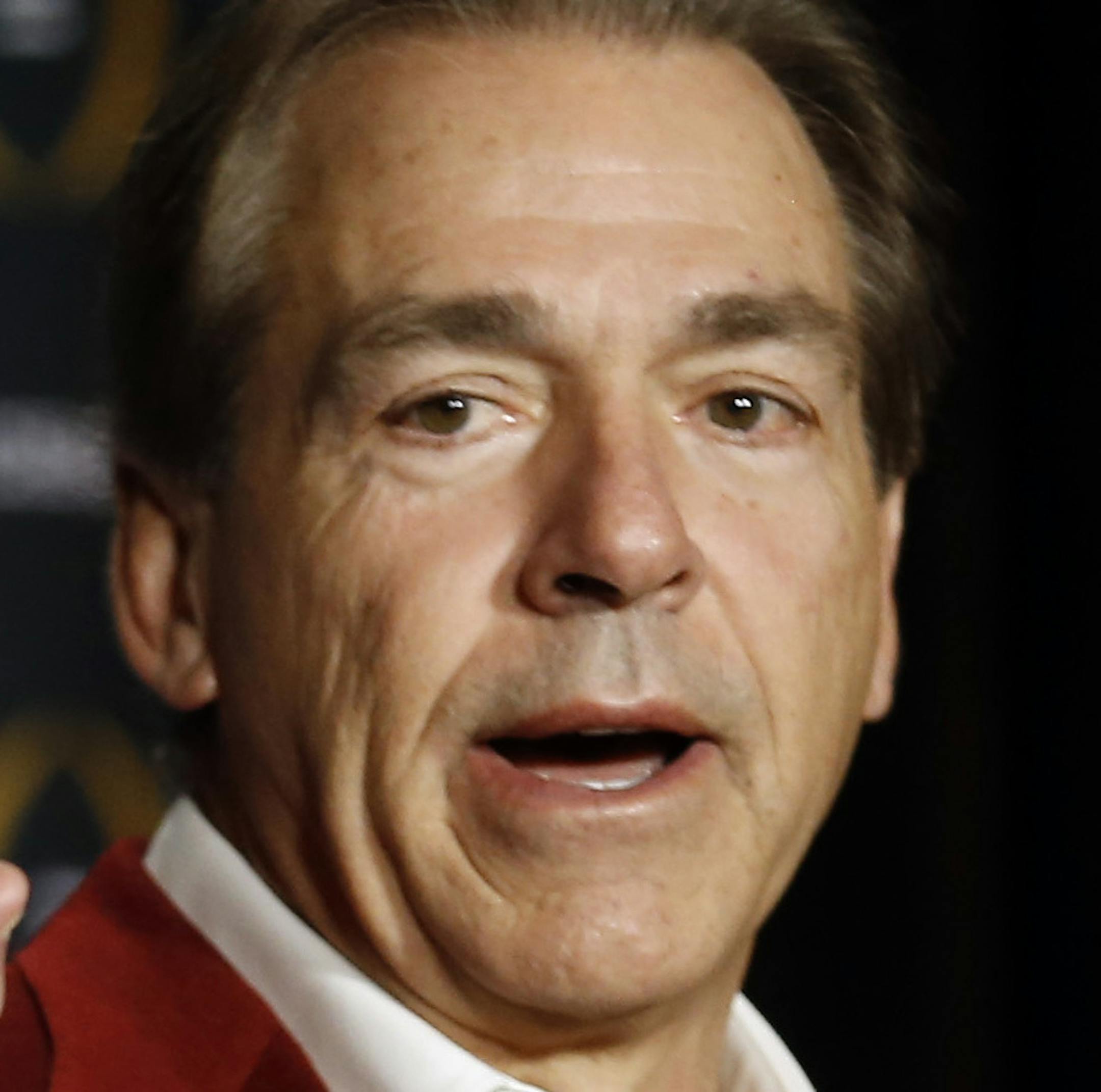 Alabama head coach Nick Saban poses with the championship trophy during a news conference for the NCAA college football playoff championship Tuesday, Jan. 12, 2016, in Scottsdale, Ariz. Alabama beat Clemson 45-40 to win the championship. (AP Photo/Morry Gash)