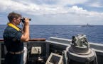 SOUTH CHINA SEA (May 20, 2022) Sa Sailor stands watch aboard the Arleigh Burke-class guided-missile destroyer USS Chung-Hoon (DDG 93) while underway w