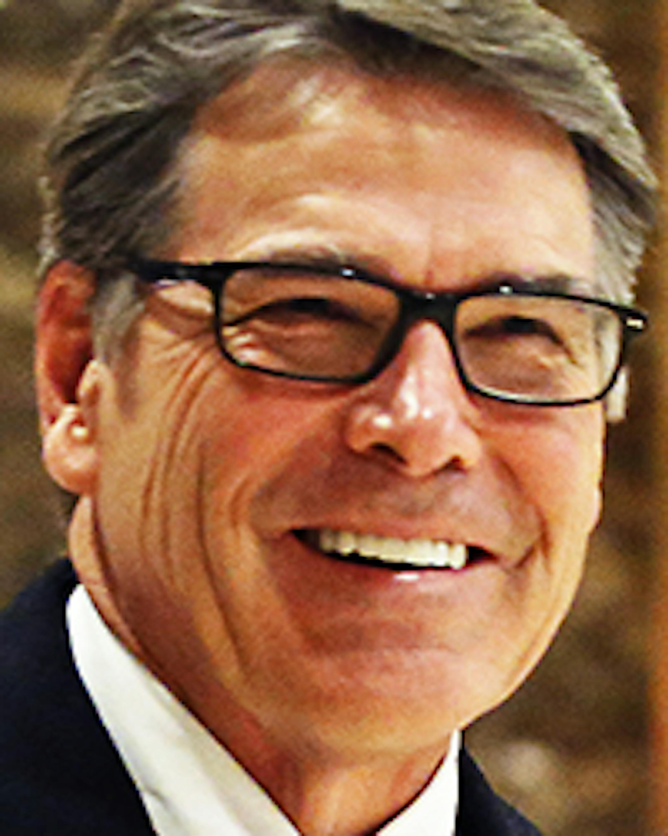 FILE - In this Dec. 12, 2016 file photo, former Texas Gov. Rick Perry smiles as he leaves Trump Tower in New York. Perry is President-elect Donald Trumpís choice to become energy secretary, two people with knowledge of the decision say. (AP Photo/Kathy Willens, File)