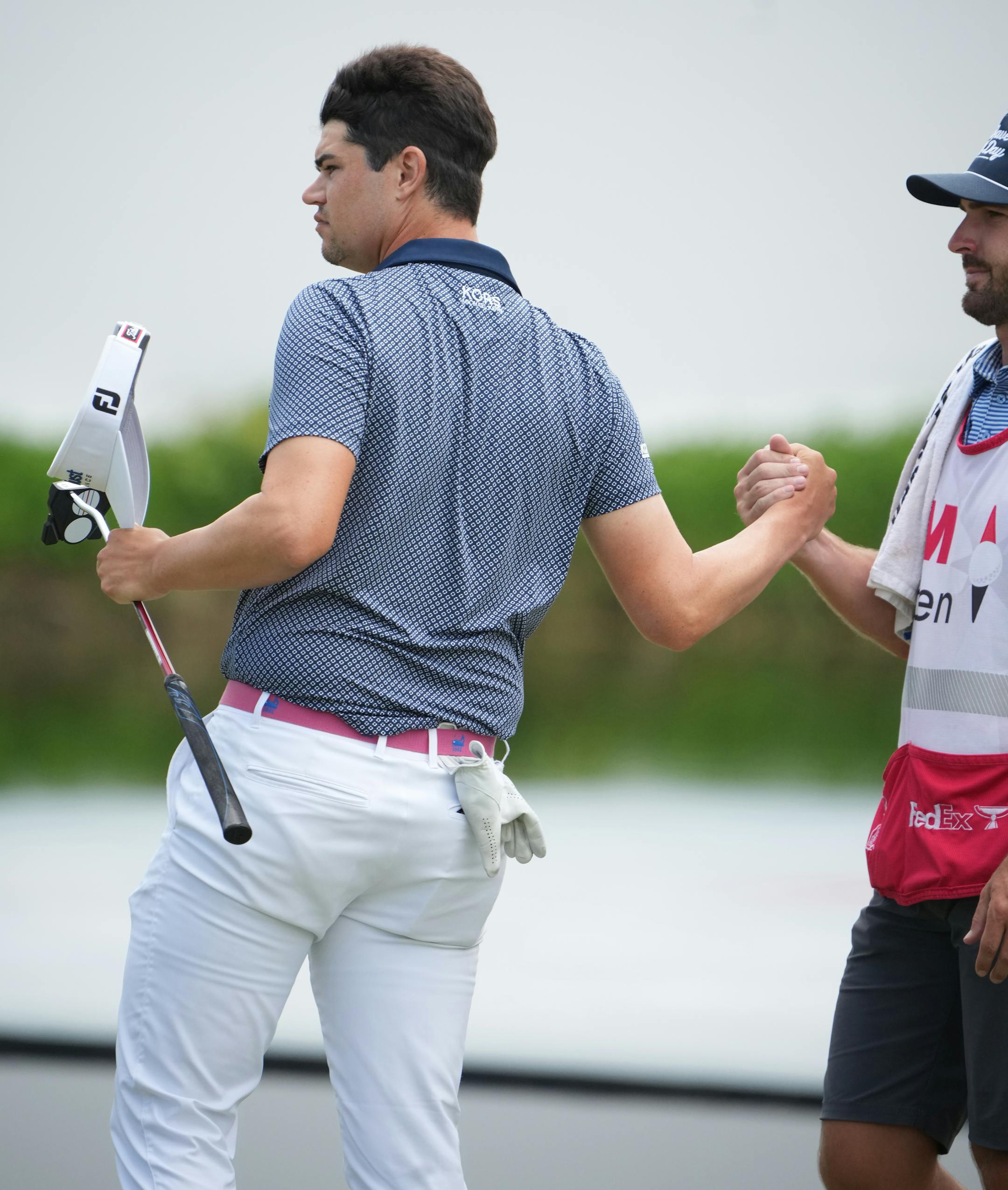 Beau Hossler shook hands with his caddy as he finishes on the 18th hole of the 3M Open Sunday at TPC Twin Cities.