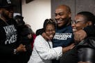 Marvin Haynes embraces his neices Destiny Coleman and Grace Coleman after being released from prison on Monday, Dec. 11, 2023 in Minneapolis, Minn. Af