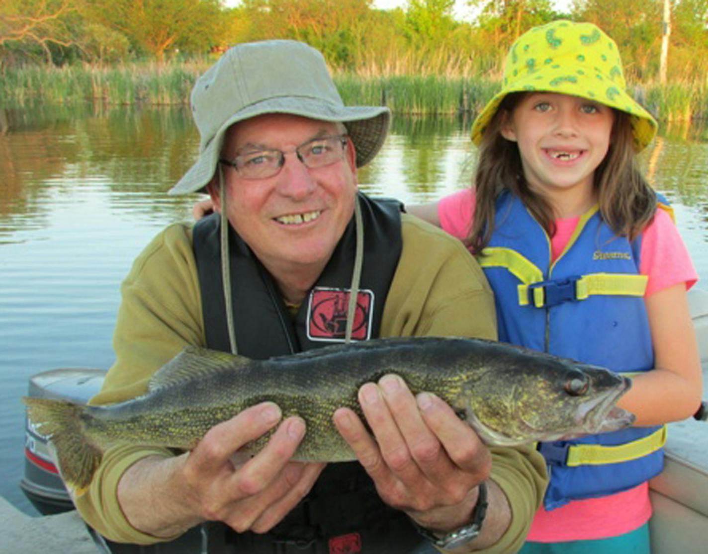 Otter Tail County holds 1,048 lakes — not only more than any other county in Minnesota but more than any county in the United States. One of those lakes is West Lost Lake, where Claire Dagel, 6, of Astoria, S.D., caught her first walleye, a 21-inch dandy, on her "Barbie" pole with a 4-pound test line. Holding her fish is grandpa Keith Hartmann of Fairmont, Minn.