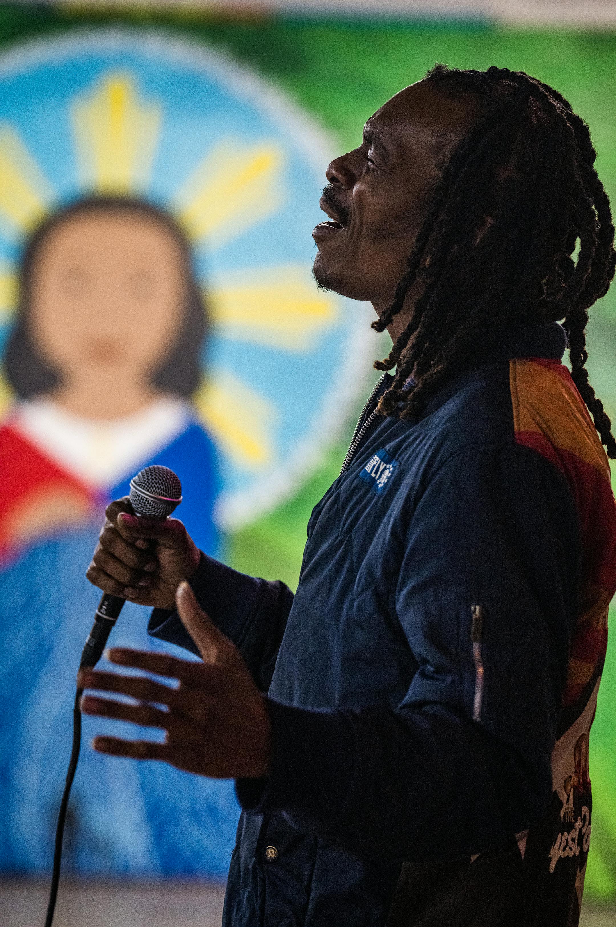 Artist Juannell Johnson performs the Black National Anthem in St. Paul during an MLK Day Celebration at the Indigenous Roots Cultural Center.
