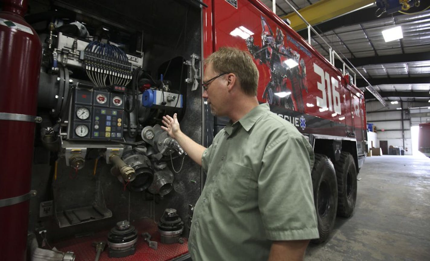 Tague Johnson, the sales coordinator for Rosenbauer America, looked at the pumping area of the crash truck that was used in the latest "Transformers" film.