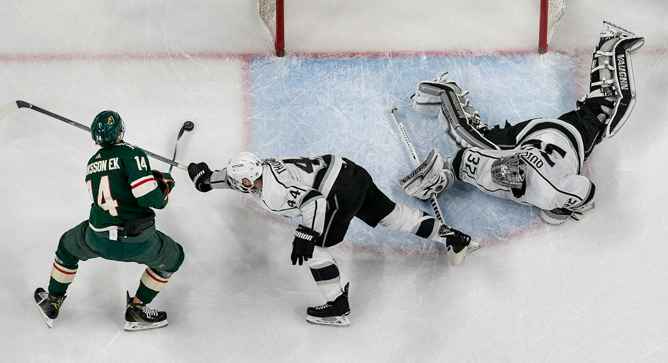 Joel Eriksson Ek (14) prepared to shoot the puck past Kings goalie Jonathan Quick (32) for a goal in the third period.