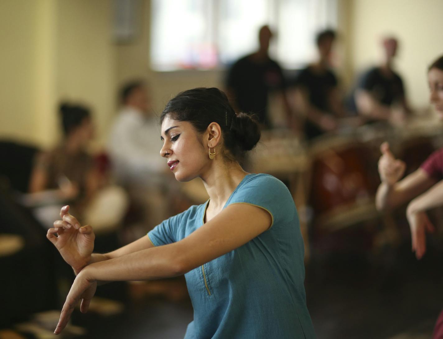 Ragamala Dance will premiere "1,001 Buddhas: Journey of the Gods" at the Cowles Center next weekend. The work is inspired by the 28 Hindu deities that guard the 1,001 Buddhist statues in a temple in Kyoto, Japan. Ragamala dancers will be joined by Indian musicians as well the Nagano, Japan-based drumming ensemble Wadaiko Ensemble Tokara for the work. Sunday afternoon, March 10, 2013 the dancers, including Ashwini Ramaswamy, and the musicians rehearsed at Ragamala's studio in MInneapolis, Minn. ]