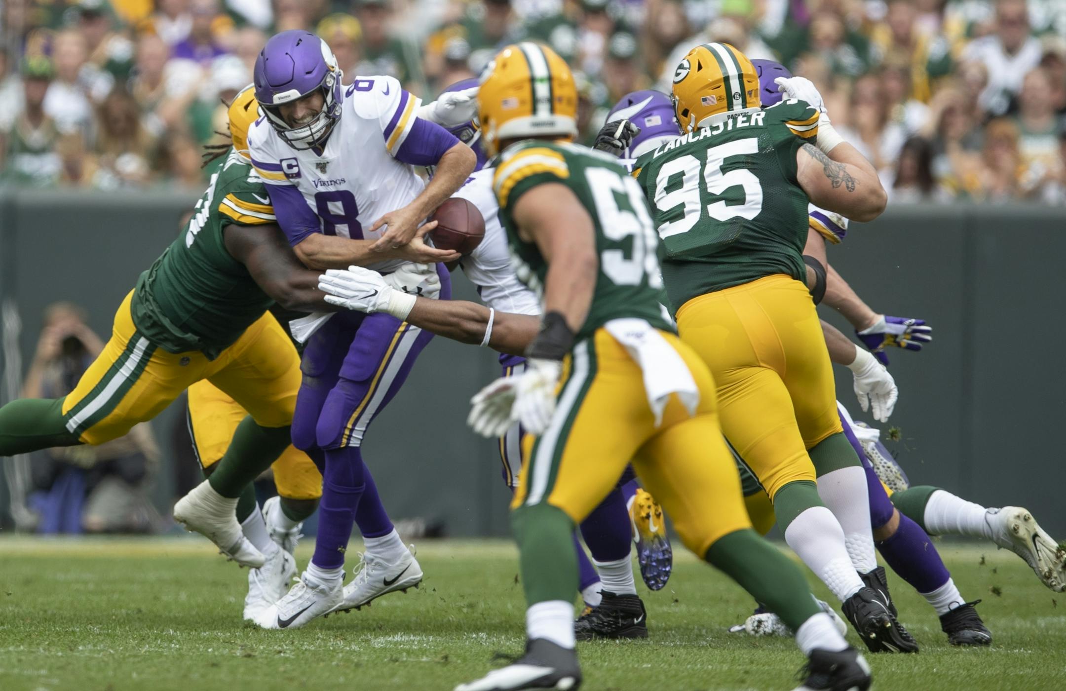 Minnesota Vikings quarterback Kirk Cousins (8) fumbled the the ball in the first quarter at Lambeau Field.