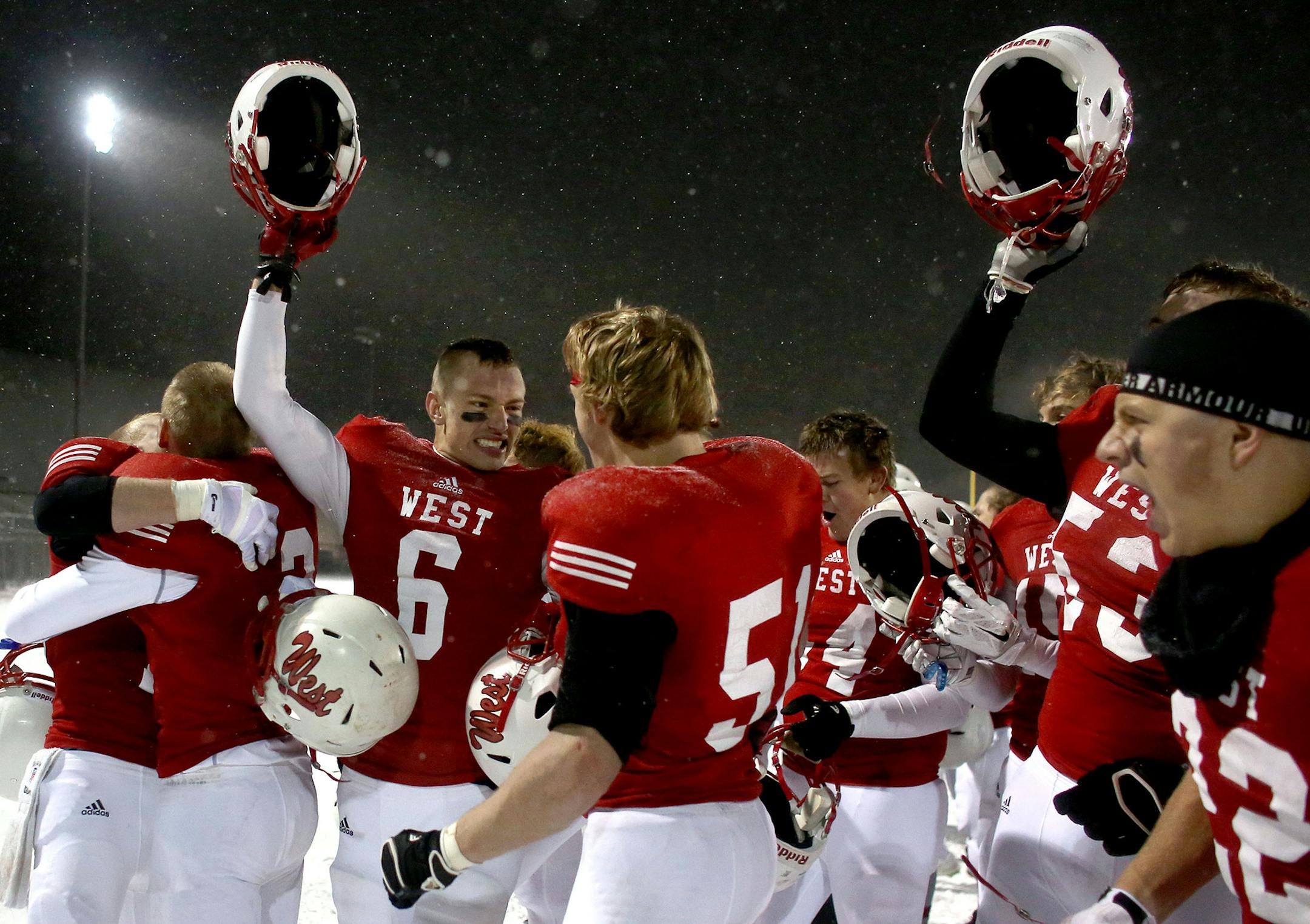 Mankato West's celebrated after their win over St. Michael-Albertville to go to the state championship. ] (KYNDELL HARKNESS/STAR TRIBUNE) kyndell.harkness@startribune.com St. Michael-Albertville vs Mankato West in state semifinals in Eden Prairie , Min., Saturday, November 15, 2014. Mankato West won 26-21 over St. Michael-Albertville