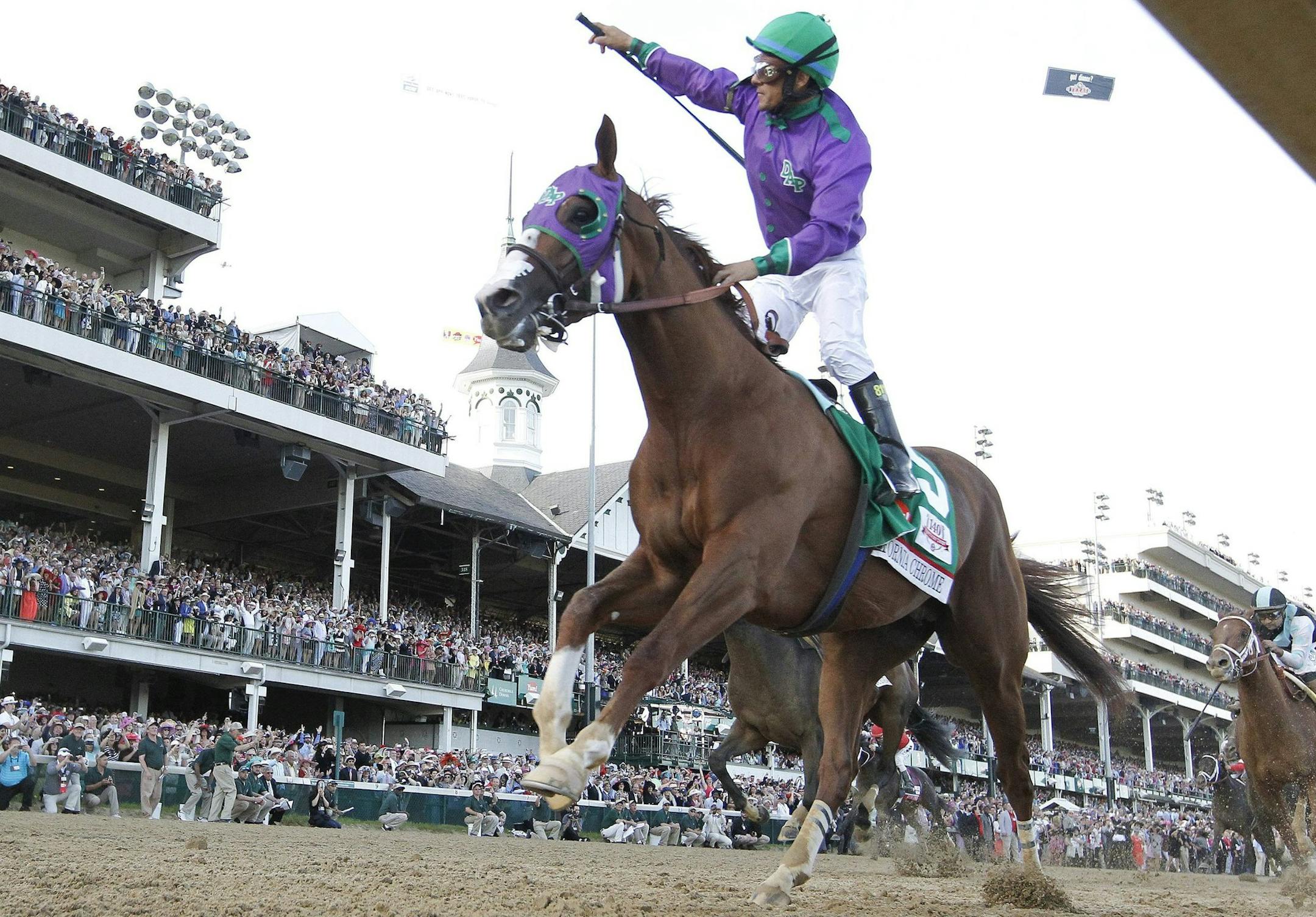 California Chrome and jockey Victor Espinoza ride to victory in the 140th running of the Kentucky Derby at Churchill Downs in Louisville, Ky., Saturday, Saturday, May 3, 2014. (David Coyle/Lexington Herald-Leader/MCT)