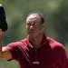 Tiger Woods tips his cap after his final round at the Masters on Sunday. The five-time Masters champion made his record 24th consecutive cut at August