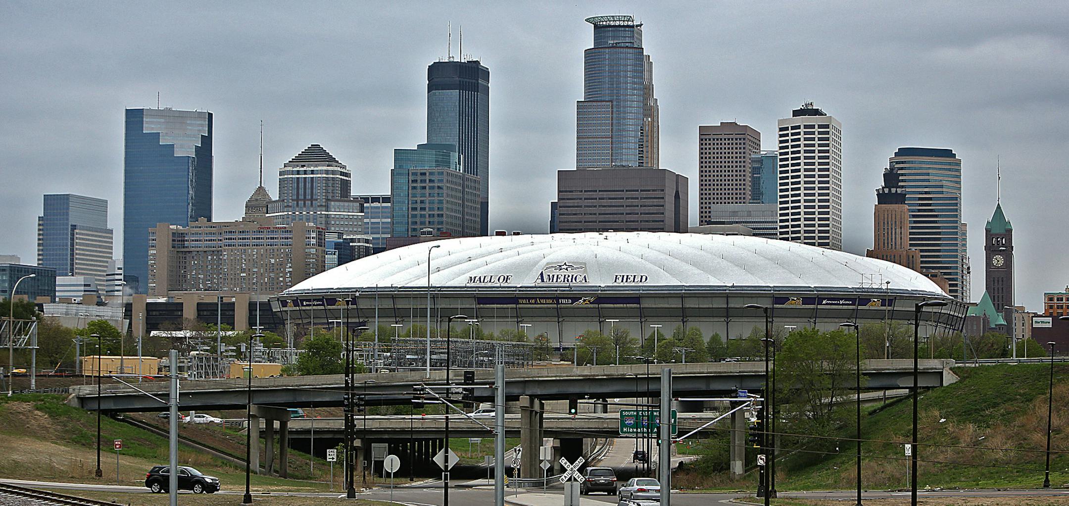The downtown Minneapolis skyline loomed over the Metrodome, looking west along Washington Avenue SE. in July 2011.