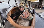 "I love flying," said 94-year-old Donal L. Russell, who sat with his son Donal S. Russell, 69, in the front seat of a 1929 biplane before a flight in 