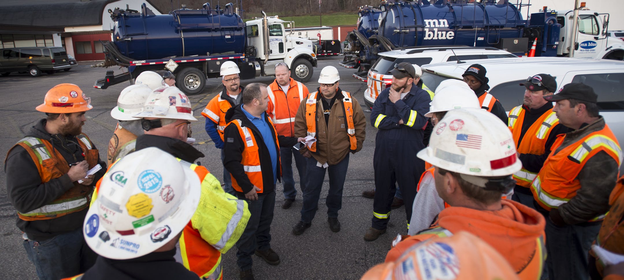 BNSF Railway held a safety meeting with hazardous materials contractors and responders Saturday in their staging area at Alma Area School before they deployed to the site of a train derailment outside Alma, Wis. ] (AARON LAVINSKY/STAR TRIBUNE) aaron.lavinsky@startribune.com Dozens of train cars derailed at about 9am on Saturday, Nov. 7, a few miles outside of Alma, Wis. The cars were carrying denatured alcohol which may be leaking into the Mississippi River.