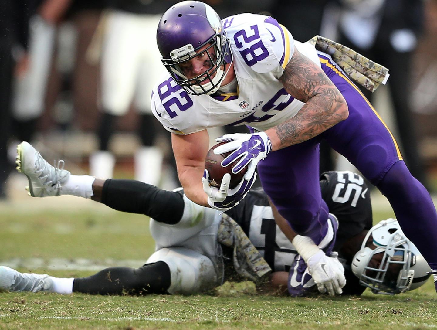 Minnesota Vikings tight end Kyle Rudolph (82) picked up a first down as he was tackled by Oakland Raiders cornerback D.J. Hayden (25) at the Oakland Coliseum Sunday November 15, 2015 in Oakland, CA. ] The Minnesota Vikings beat at the Oakland Raiders 30-14 in the Coliseum. Jerry Holt/ Jerry.Holt@Startribune.com