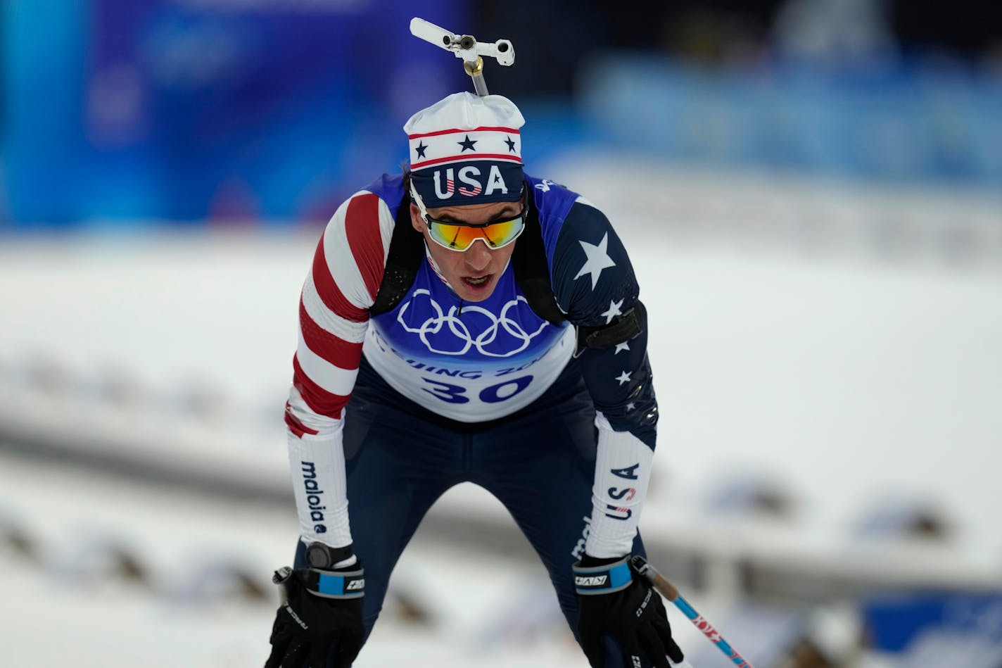 Paul Schommer crosses the finish line during the men's 20-kilometer individual race at the 2022 Winter Olympics, Tuesday, Feb. 8, 2022, in Zhangjiakou, China. (AP Photo/Kirsty Wigglesworth)