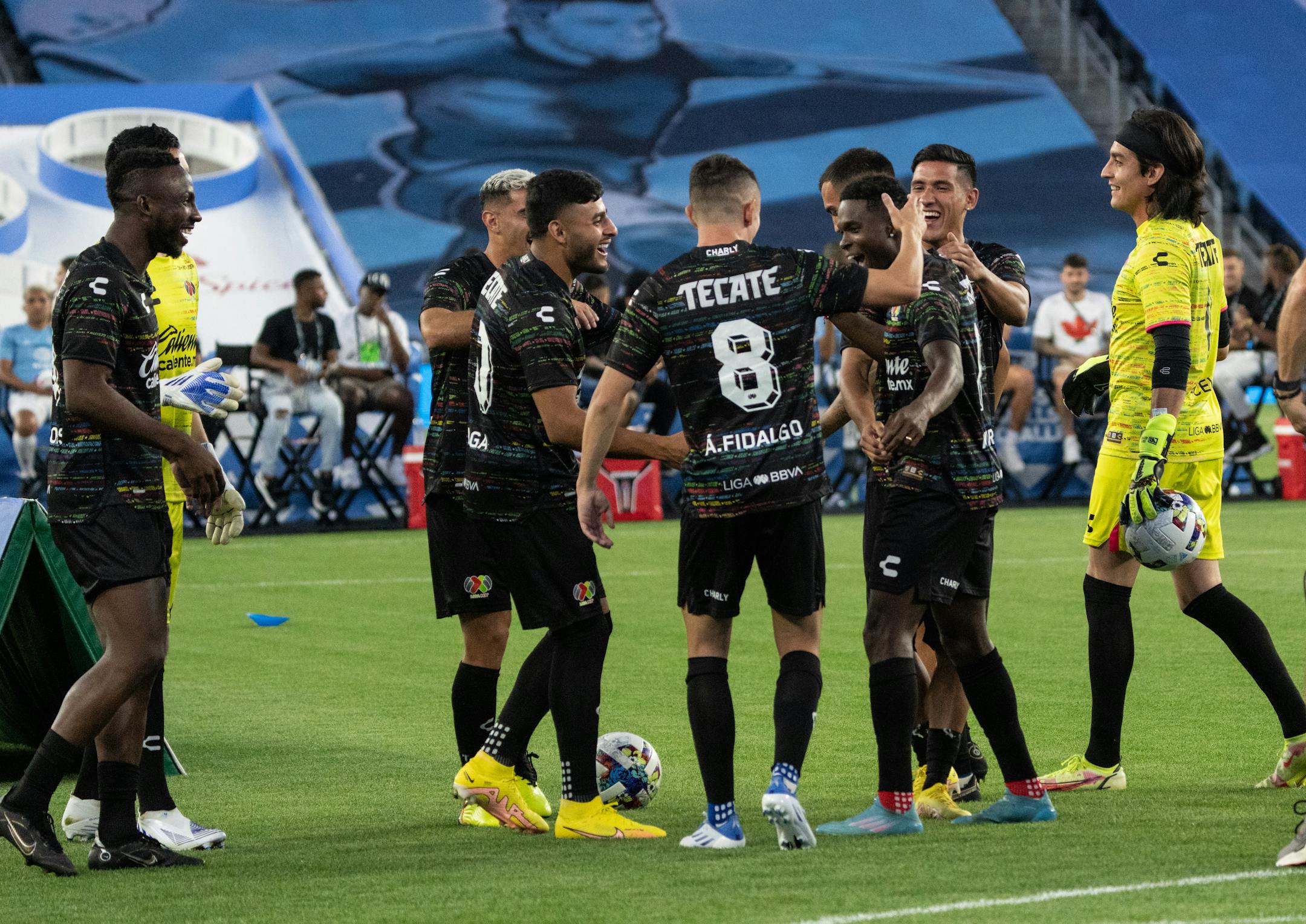 Teammates celebrate with Mexico Liga MX midfielder Avil's Hurtado (11), who scored on several bicycle kicks, to make Liga MX the Cross and Volley Challenge champions.
