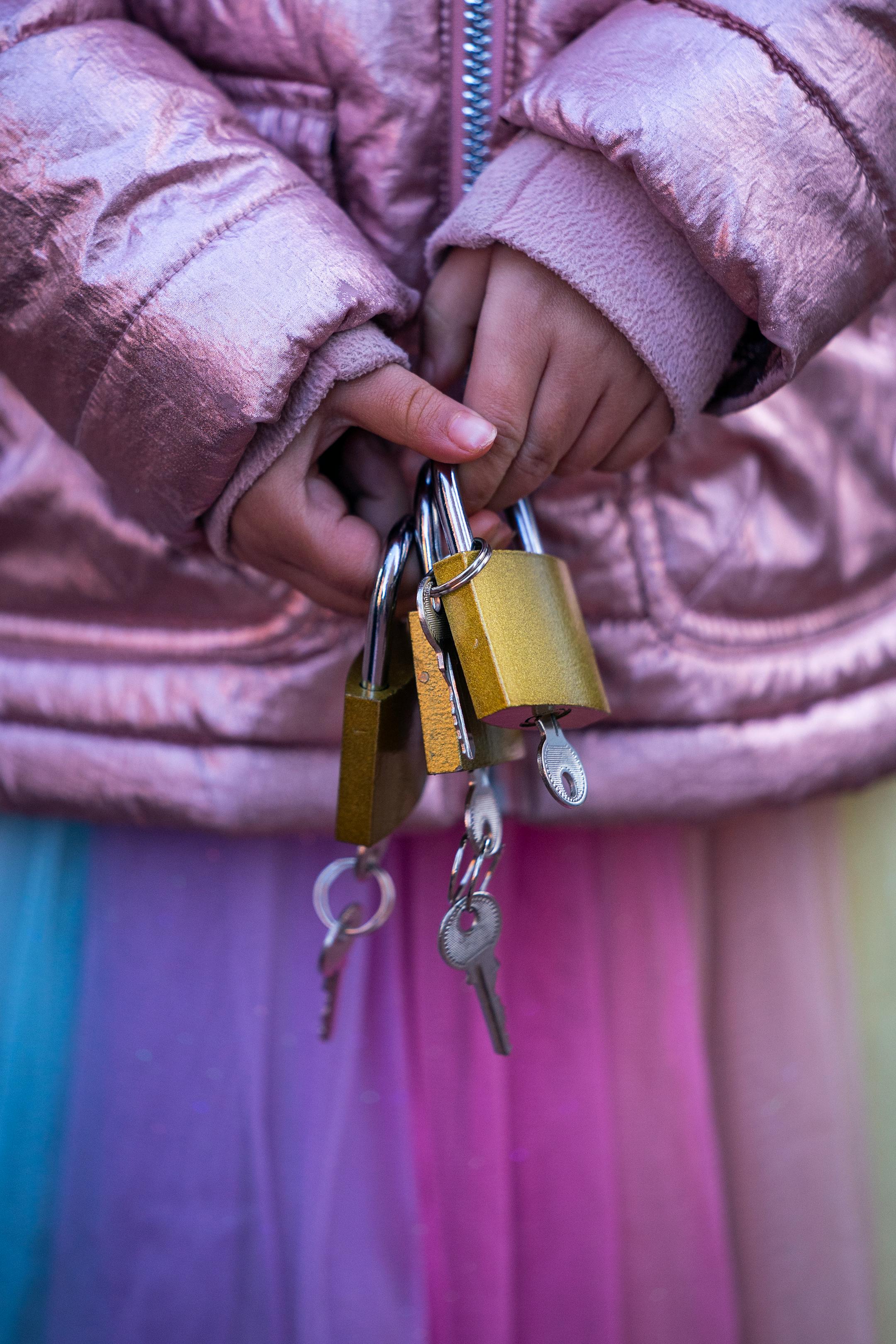 Zeriah Myette, 4, of Elk River held locks to place on the fence outside the Hennepin County Government Center during the Locks for Loved Ones Lost: Part II event.