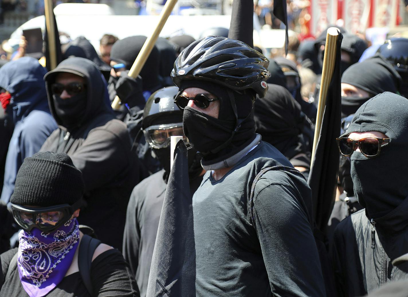 Antifa protesters dressed in black, demonstrate during a &#x201c;Stand Against Hate&#x201d; rally at Martin Luther King Jr. Civic Center Park in Berkeley, Calif., Aug. 27, 2017. (Jim Wilson/The New York Times) ORG XMIT: MIN2017083012293242