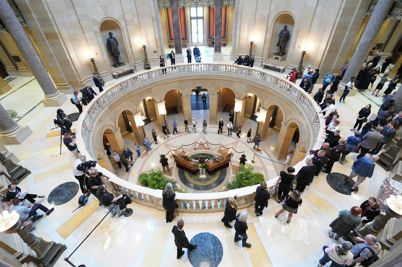 Mourners pay their respects at the Lying in State of Minnesota State Representative Melissa Hortman, Mark Hortman and their dog, Gilbert, at the Minnesota State Capitol in St. Paul.