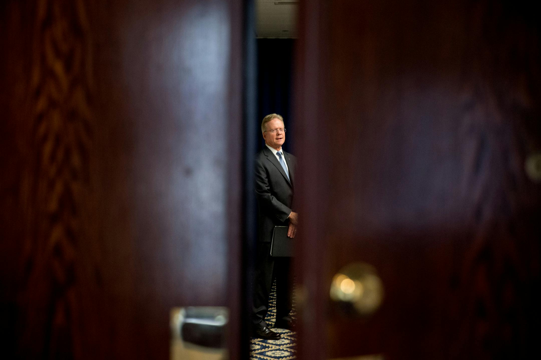 Former Virginia Sen. Jim Webb waits in a side room before announcing he will drop out of the Democratic race for president, Tuesday, Oct. 20, 2015, at the National Press Club in Washington. (AP Photo/Andrew Harnik)