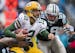 Green Bay Packers quarterback Aaron Rodgers (12) is sacked by Carolina Panthers defensive tackle Star Lotulelei (98) and Carolina Panthers linebacker 