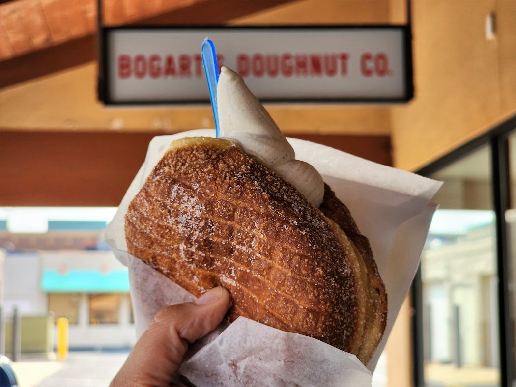 A brioche doughnut is filled with brown butter ice cream at Bogart’s.