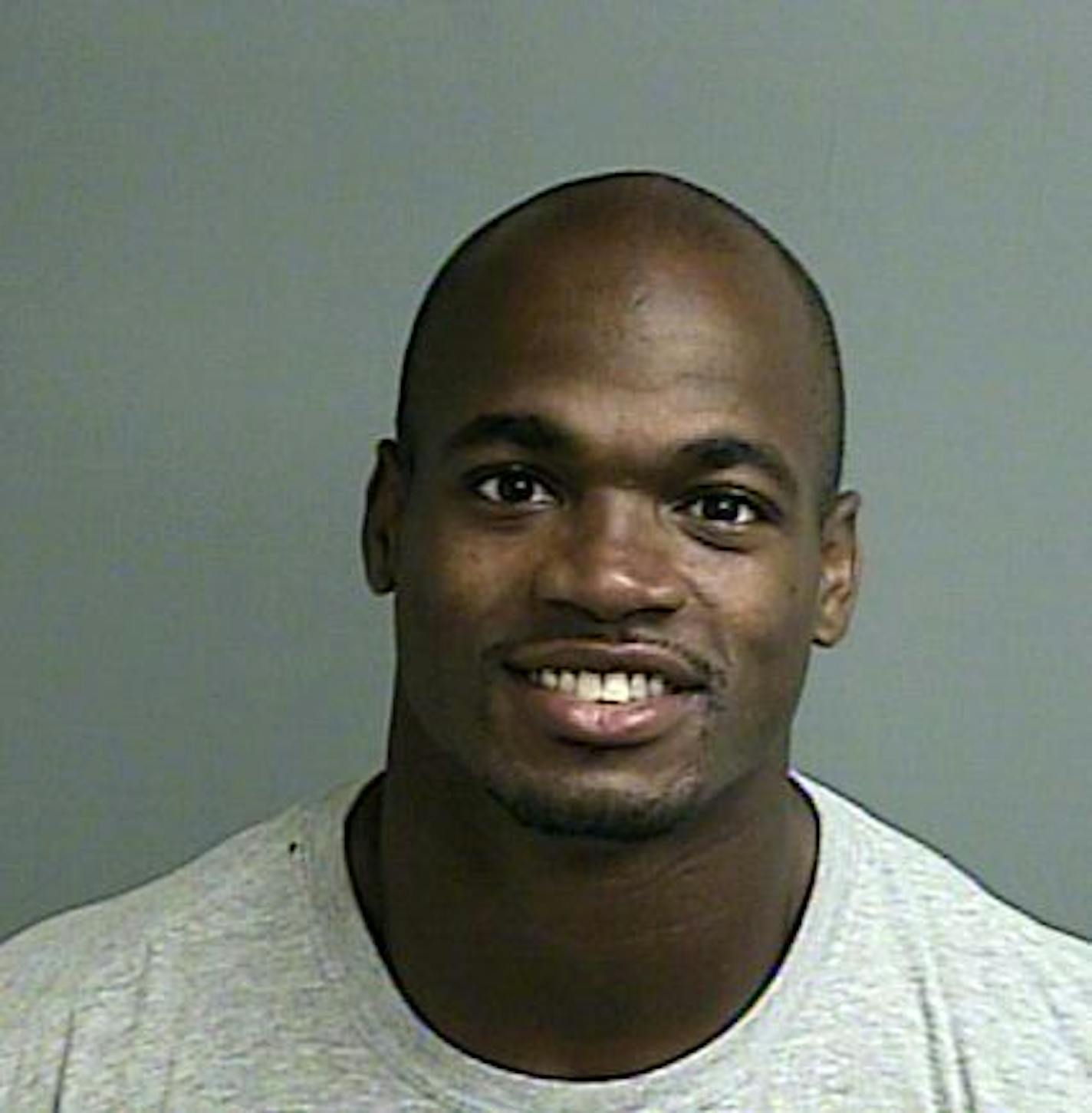 This photo provided by the Montgomery County sheriff&#x2019;s office shows the booking photo of Adrian Peterson. Peterson was indicted in Texas for using a branch to spank one of his sons and the Minnesota Vikings promptly benched him for their game Sunday, Sept. 14, 2014 against the New England Patriots. Peterson turned himself in early Saturday at a jail in Montgomery County, near Houston, where he has a home. He was processed and released. (AP Photo/Montgomery County sheriff&#x2019;s office)