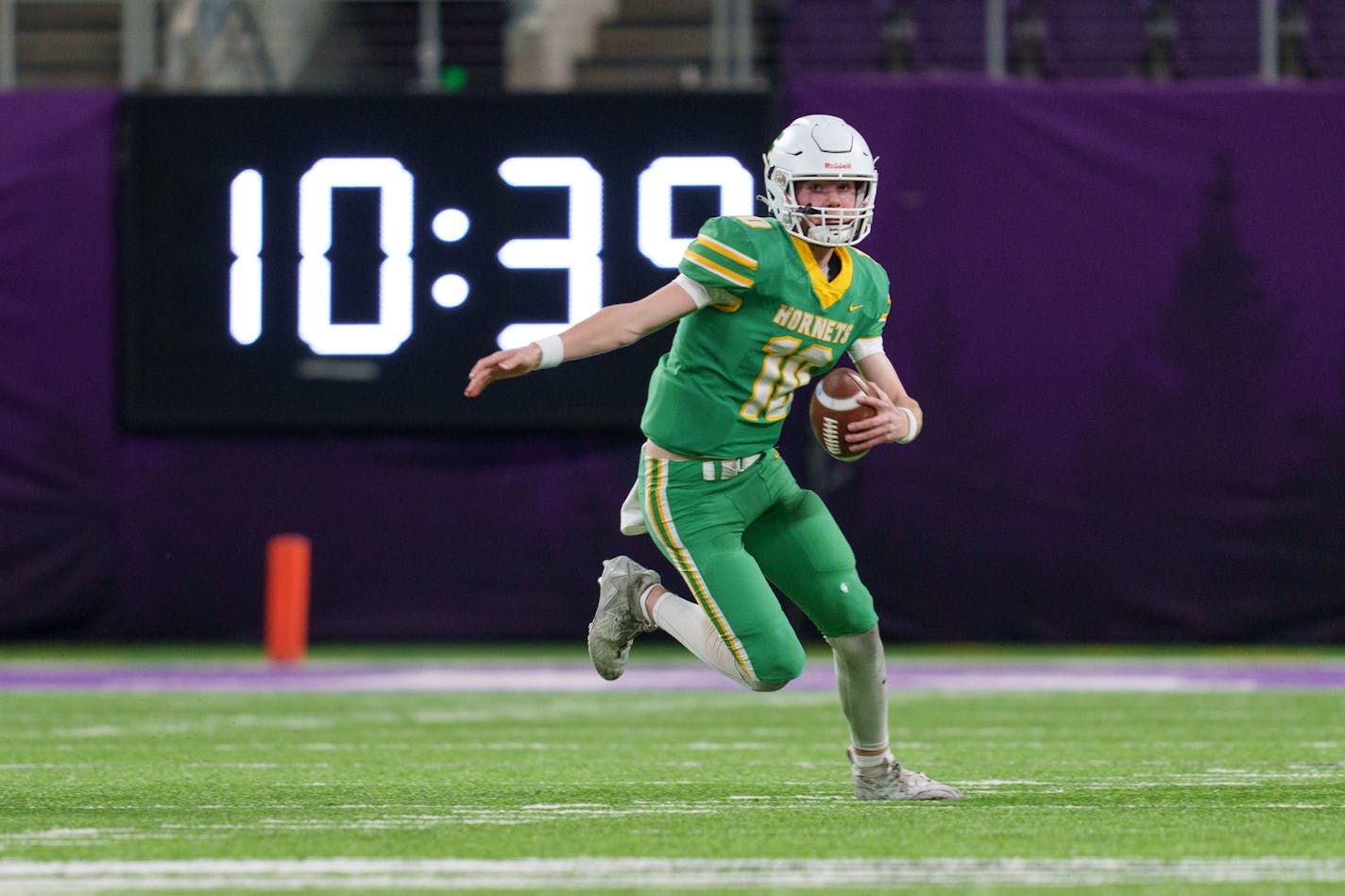 Edina quarterback Mason West (10) runs with the ball in the first quarter against the Eden Prairie in the Class 6A state semifinal football game between Eden Prairie and Edina played at U.S. Bank Stadium on Friday, Nov. 17, 2023. Photo by Matt Blewett, Special to Star Tribune matt@mattebphoto.com