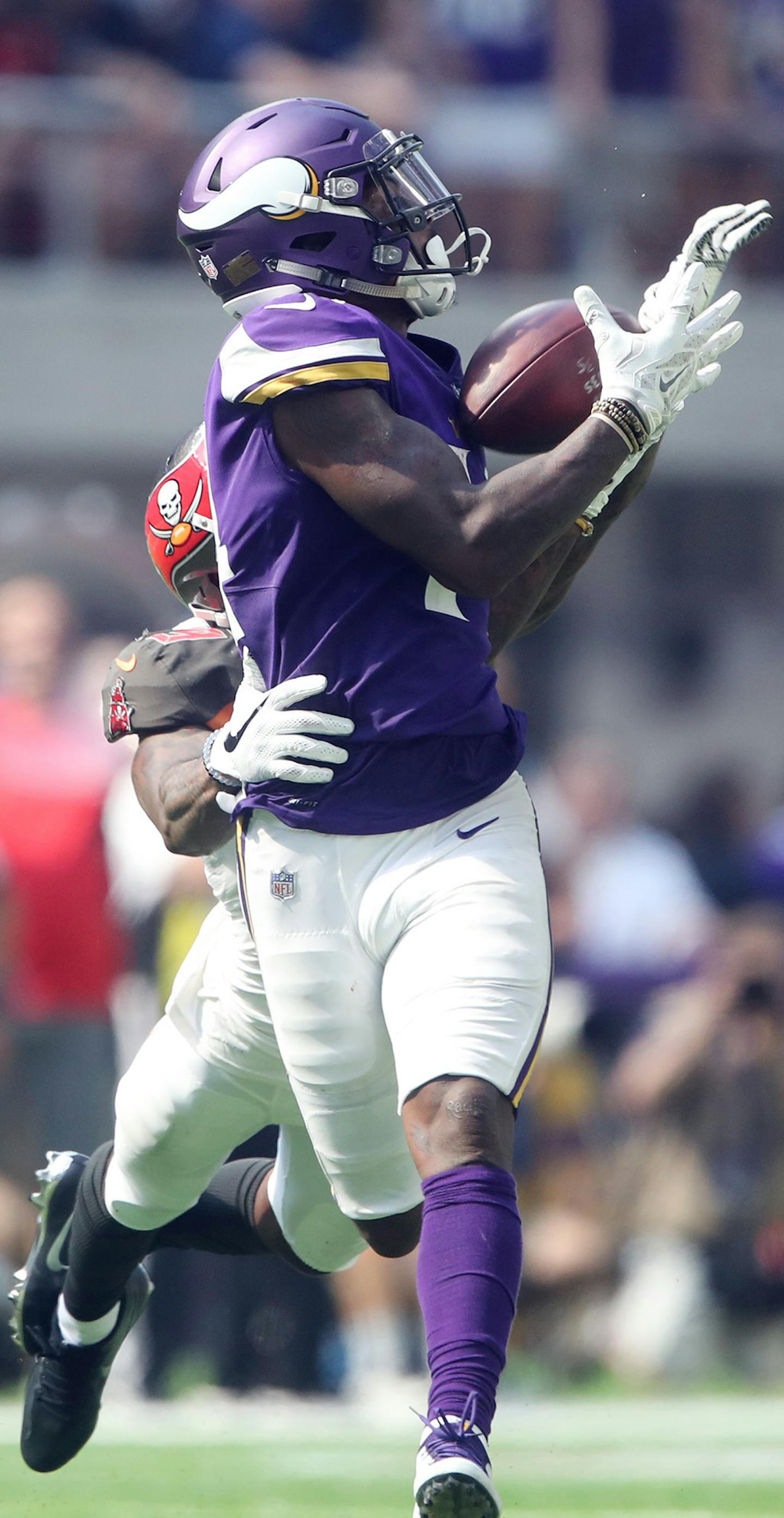 Minnesota Vikings wide receiver Stefon Diggs (14) pulled down a 47 yard catch over Tampa Bay Buccaneers cornerback Ryan Smith (29) in second quarter atU.S. Bank Stadium Sunday September 24,2017 in Minneapolis ,MN. ] JERRY HOLT &#xef; jerry.holt@startribune.com Jerry Holt