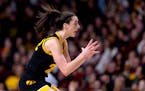 Iowa star Caitlin Clark reacts to a second-quarter play against the Gophers on Wednesday at Williams Arena.