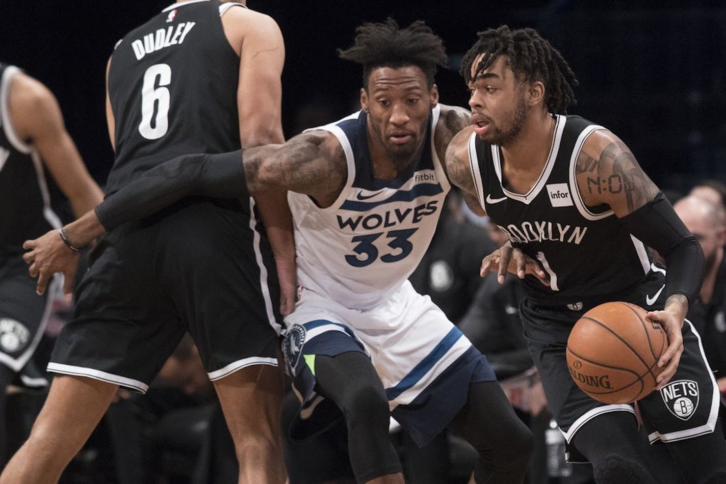 Brooklyn Nets guard D'Angelo Russell (1) drives to the basket against Minnesota Timberwolves forward Robert Covington (33) during the first half of an NBA basketball game, Friday, Nov. 23, 2018, in New York.