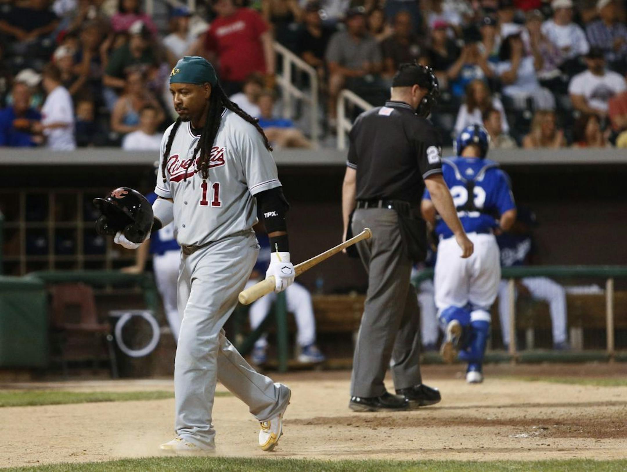 Manny Ramirez, playing for the Sacramento RiverCats, walks back to the dugout after striking out to end the top of the fifth inning in a Triple-A baseball game against the Albuquerque Isotopes in Albuquerque, N.M., Saturday, May 19, 2012.