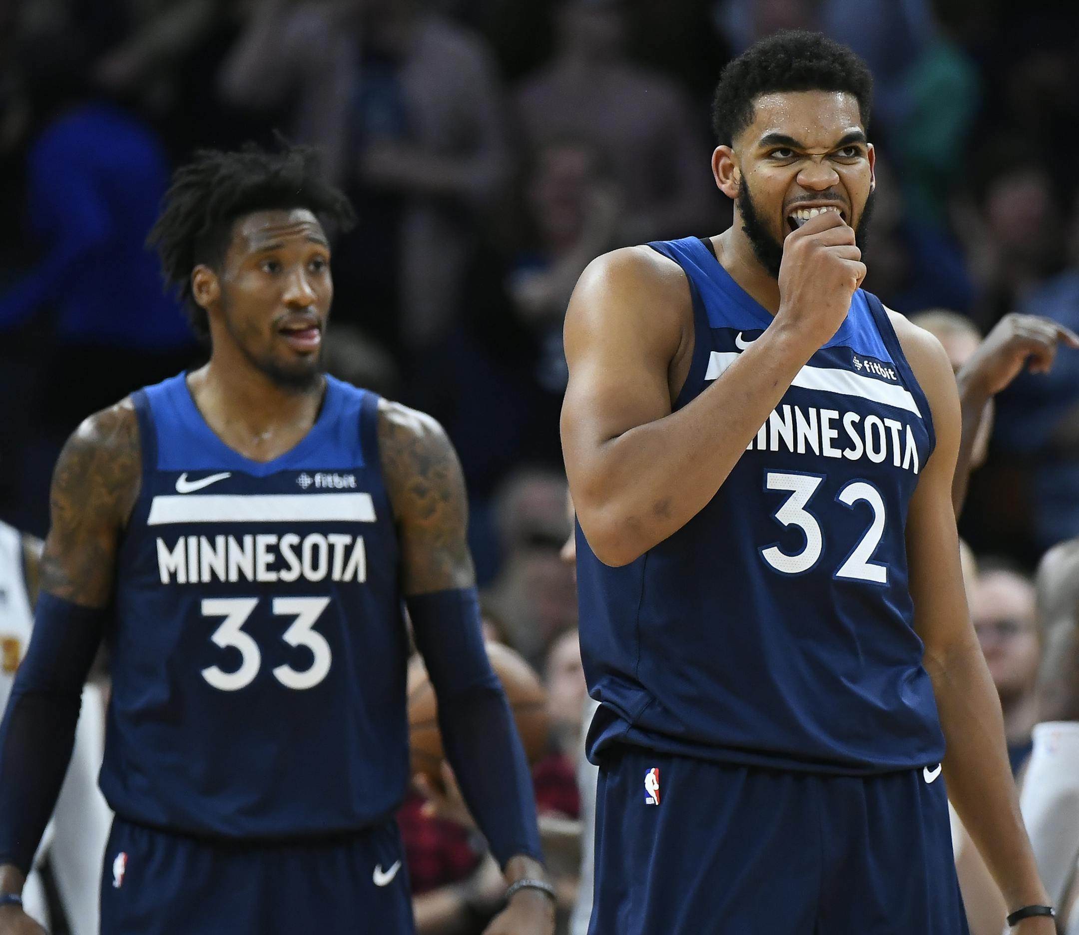 Minnesota Timberwolves center Karl-Anthony Towns (32) reacted after dunking the ball as he was fouled by Denver Nuggets forward Paul Millsap (4) for an and-one opportunity in the second half. ] Aaron Lavinsky • aaron.lavinsky@startribune.com The Minnesota Timberwolves played the Denver Nuggets on Wednesday, Nov. 21, 2018 at Target Center in Minneapolis, Minn.