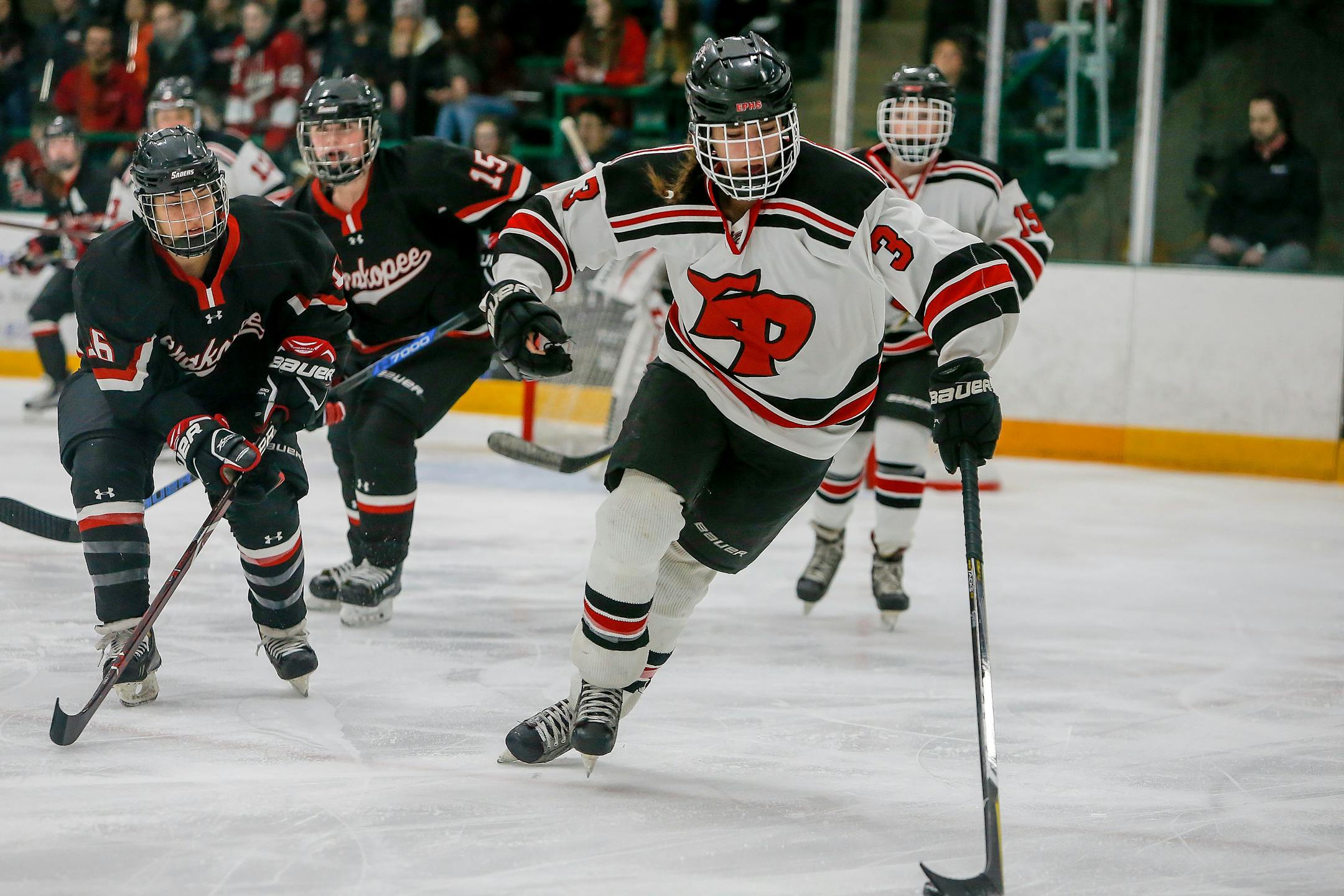 Eden Prairie sophomore Sydney Langseth (3) pushed the puck up ice ahead of Shakopee's Dani Hennen during a Class 2A, Section 2 girls' hockey championship game at Braemar Arena. Langseth scored all three goals in the Eagles' 3-0 victory.