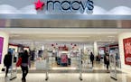 Shoppers enter a Macy's department store in Bay Shore, Long Island, New York, Dec. 12, 2023.
