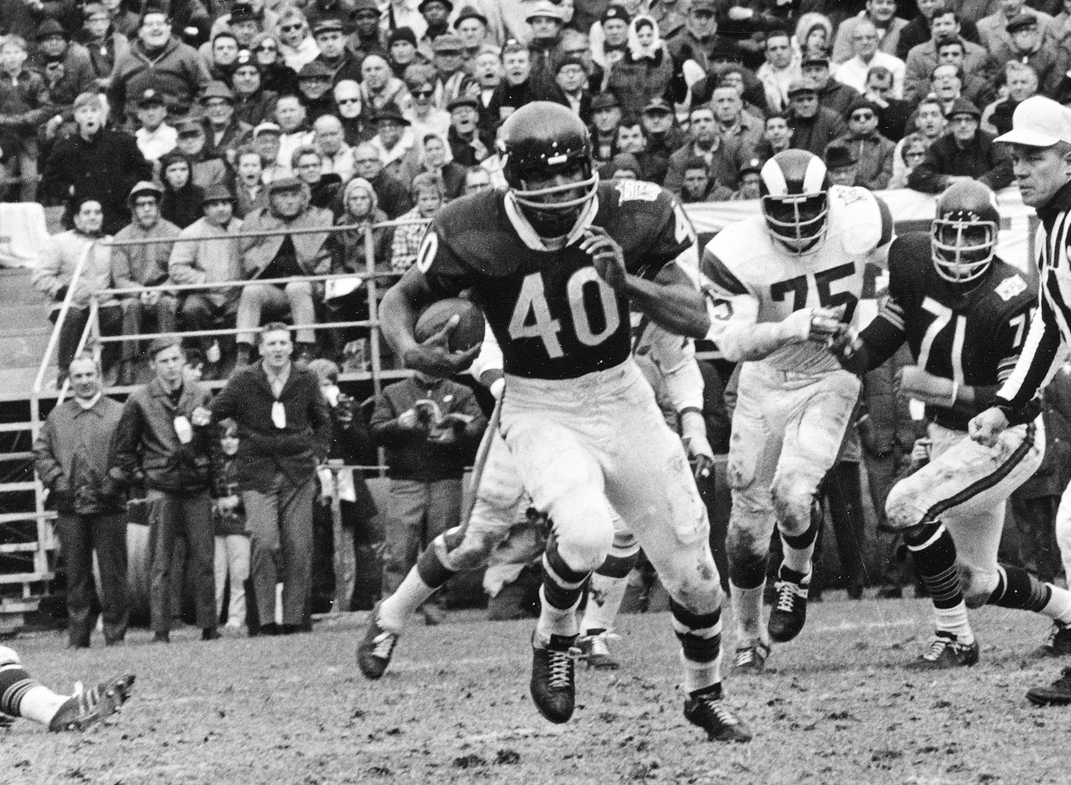 FILE - In this Oct. 27, 1969, file photo, Chicago Bears running back Gale Sayers (40) runs for a 28-yard gain against the Los Angeles Rams, in Chicago, Ill. Hall of Famer Gale Sayers, who made his mark as one of the NFL's best all-purpose running backs and was later celebrated for his enduring friendship with a Chicago Bears teammate with cancer, has died. He was 77. Nicknamed "The Kansas Comet" and considered among the best open-field runners the game has ever seen, Sayers died Wednesday, Sept.