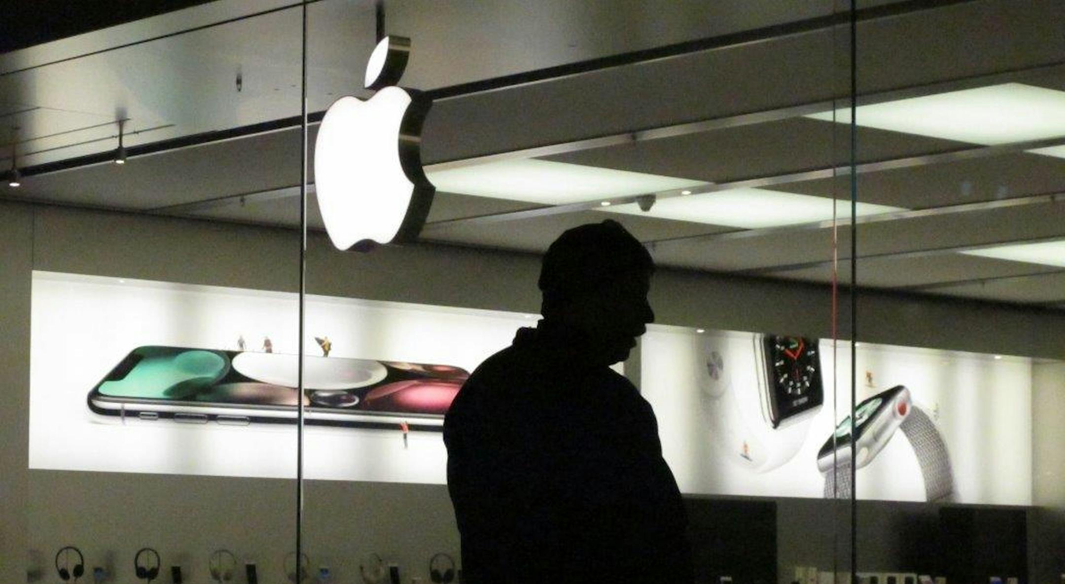Paul Kain waits for an Apple store to open Friday, Nov. 24, 2017, at a mall in Anchorage, Alaska. Kain, of Seward, Alaska, was among those hitting the stores for Black Friday shopping the day after Thanksgiving. He was planning to buy a coveted iPhone X at the Apple store. (AP Photo/Rachel D'Oro)