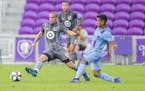 Minnesota United FC's Ozzie Alonso (6) fights for a loose ball during the first half of an MLS soccer match against New York City FC, in Orlando, Fla.