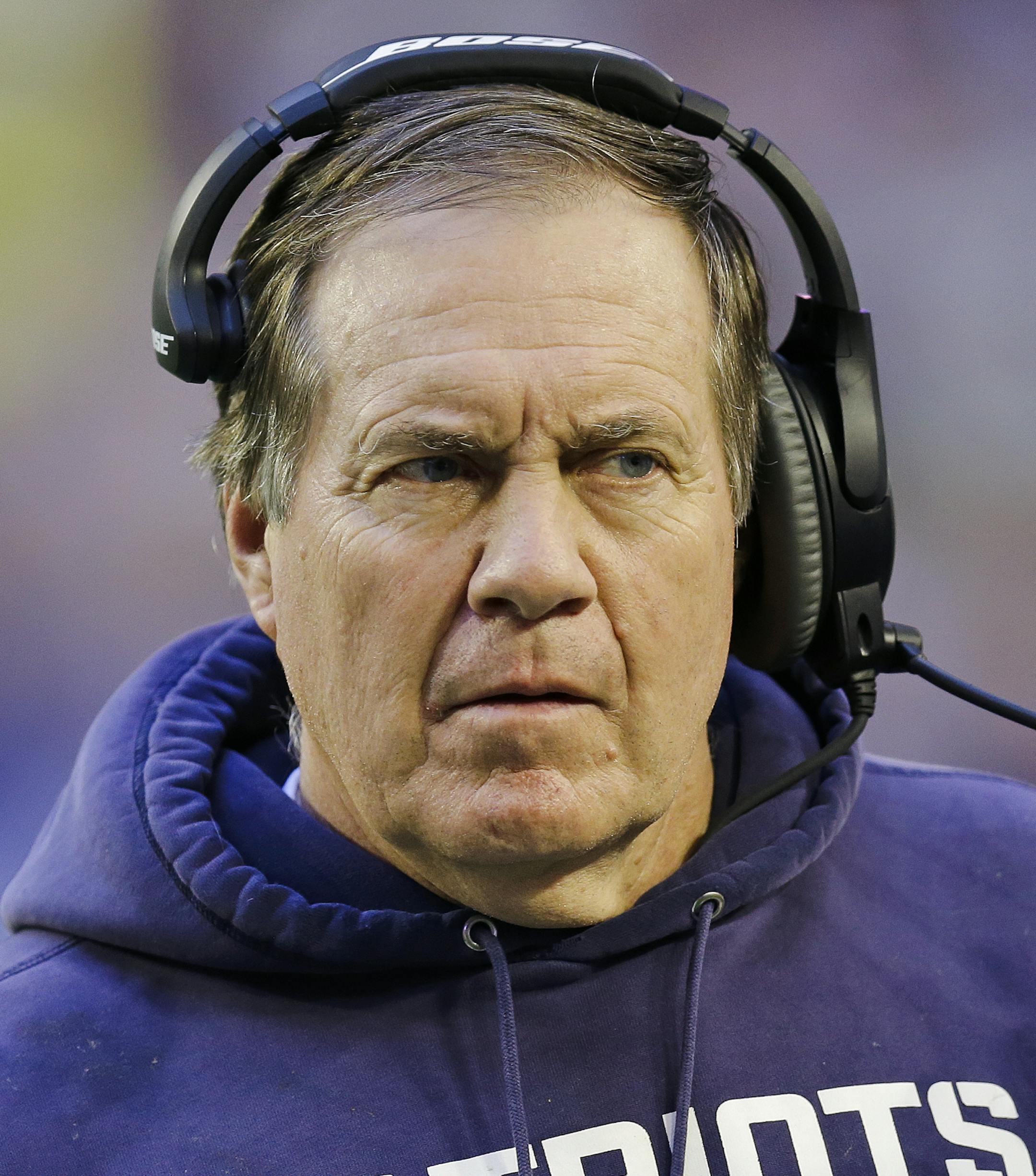 New England Patriots head coach Bill Belichick adjusts his headphones during the first half of NFL Super Bowl XLIX football game against the Seattle Seahawks Sunday, Feb. 1, 2015, in Glendale, Ariz. (AP Photo/Ben Margot) ORG XMIT: NFL1